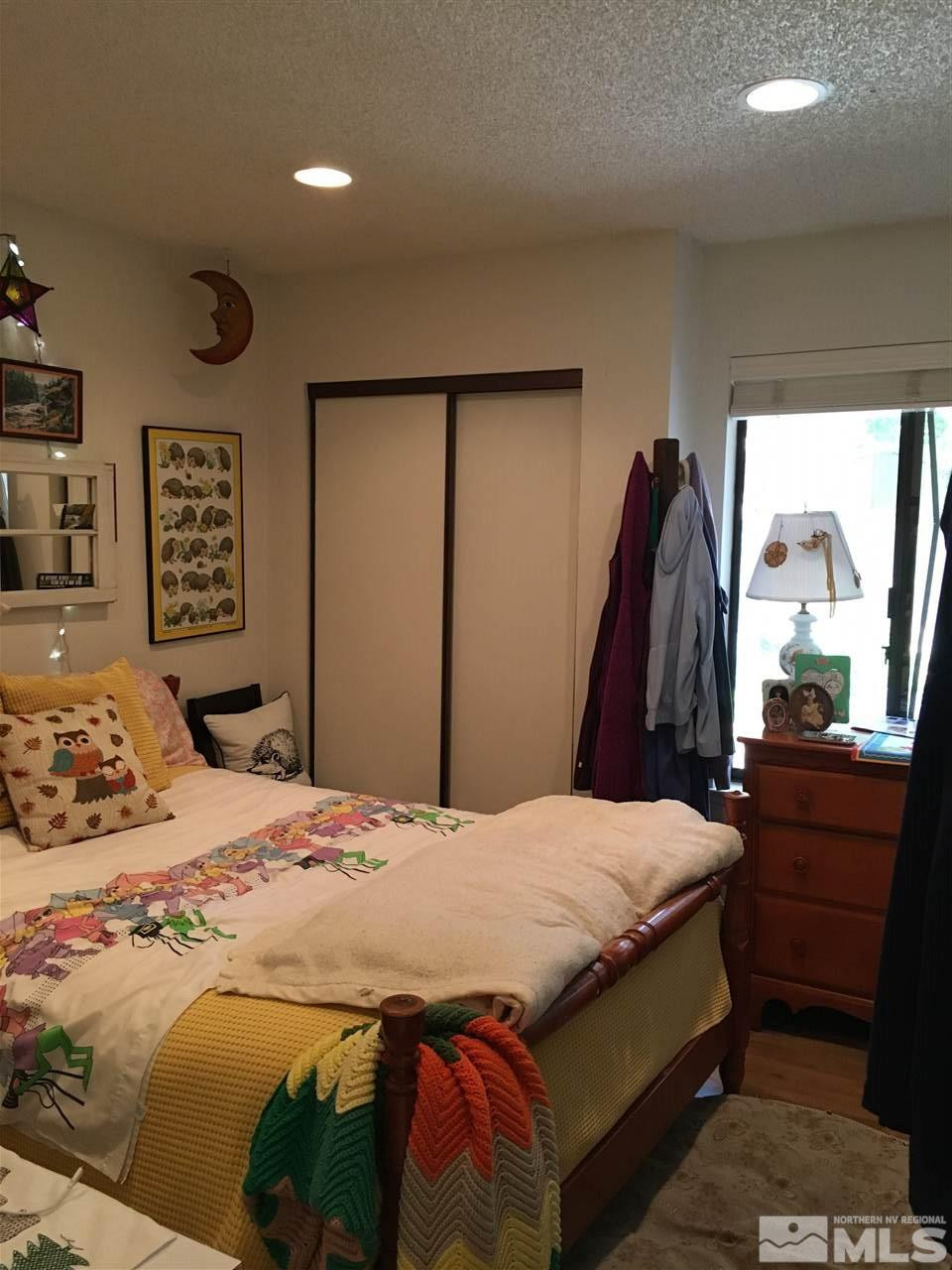 1611 Foster Drive Reno, NV 89509 - Photo 24 of 35 a bedroom with a bed and a large mirror