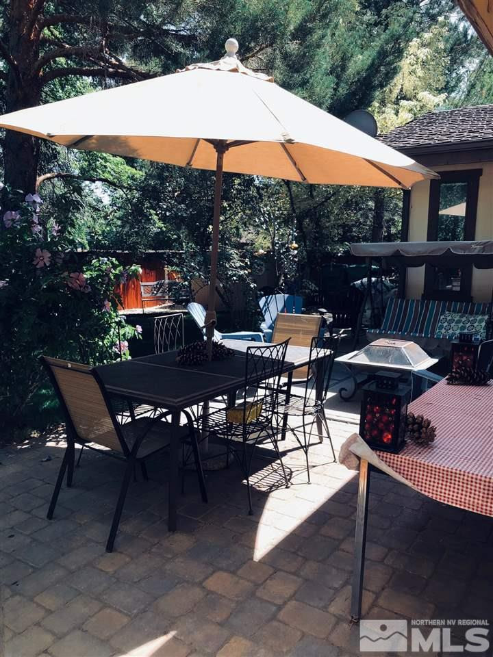 1611 Foster Drive Reno, NV 89509 - Photo 31 of 35 a patio with tables and chairs