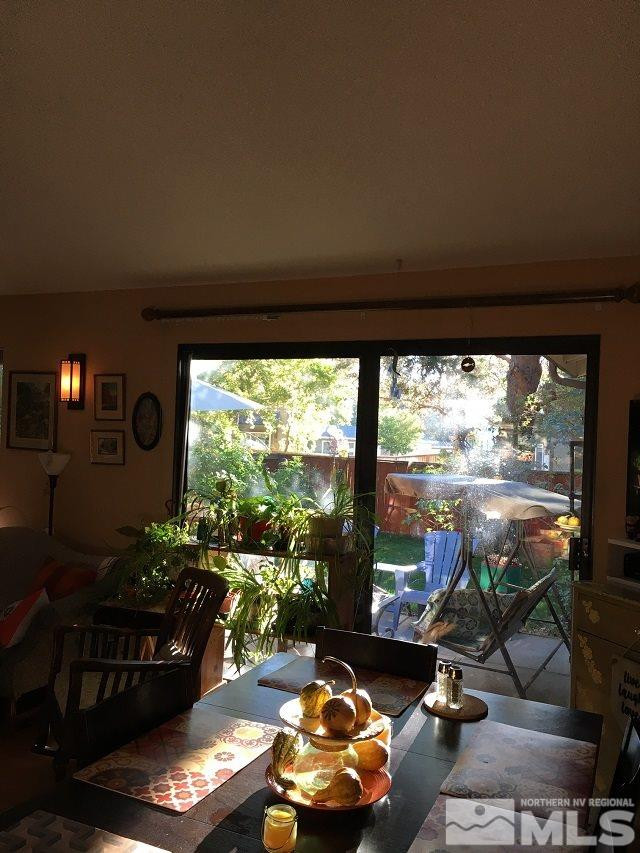 1611 Foster Drive Reno, NV 89509 - Photo 9 of 35 a room with furniture and a floor to ceiling window