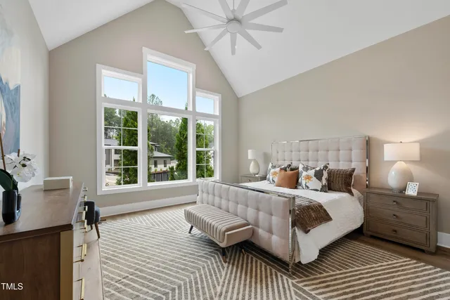 a view of wooden floor and chandelier fan in a room