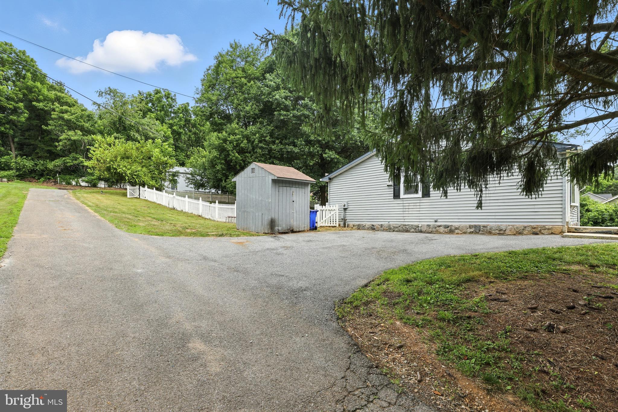 6220 Fulmer Road Frederick, MD 21703 - Photo 8 of 37 a view of backyard of house with outdoor seating and green space