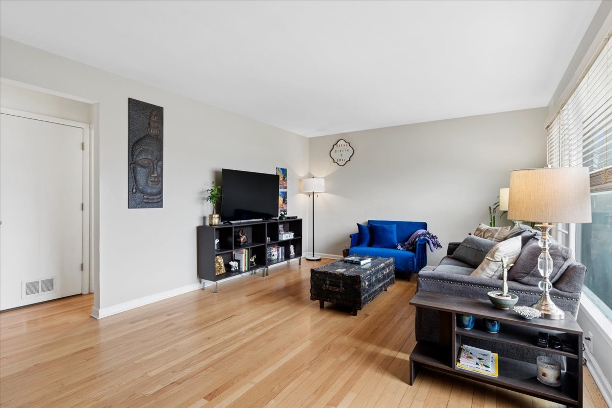 504 North Russel Street Mount Prospect, IL 60056 - Photo 2 of 19 a living room with furniture and a flat screen tv