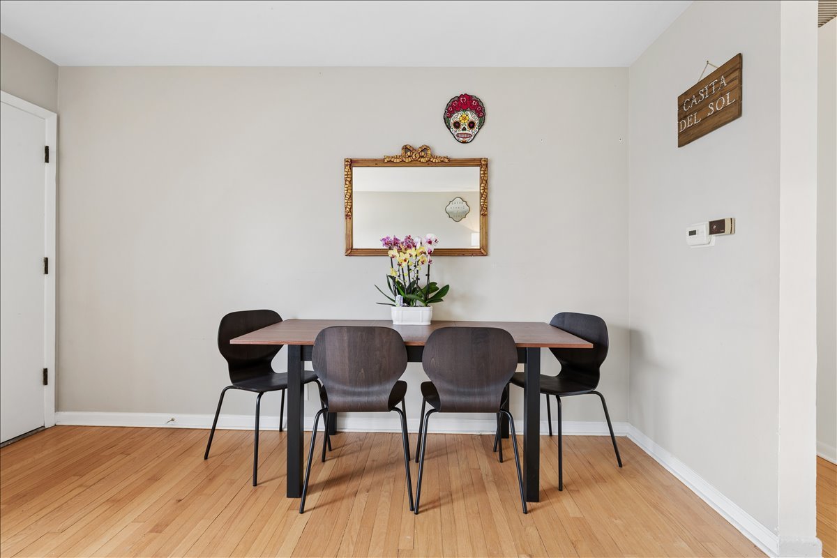 504 North Russel Street Mount Prospect, IL 60056 - Photo 5 of 19 a view of a dining room with furniture and wooden floor