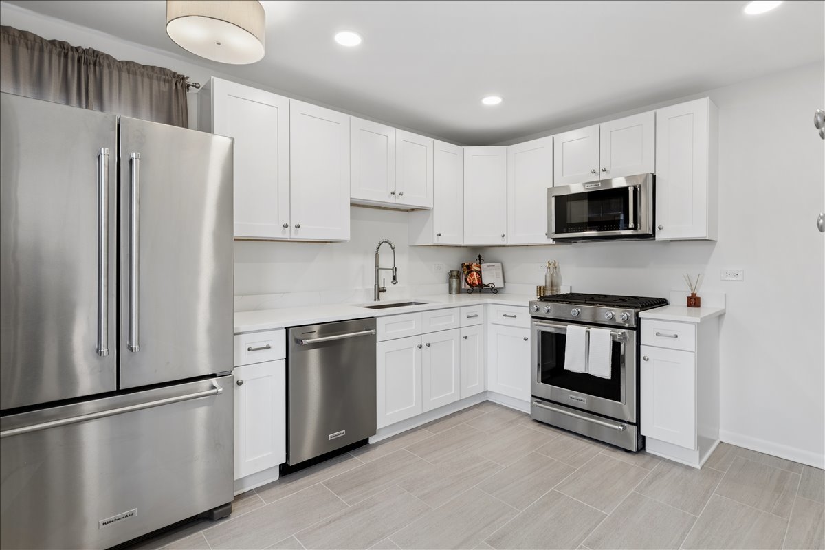 504 North Russel Street Mount Prospect, IL 60056 - Photo 8 of 19 a kitchen with cabinets stainless steel appliances and a counter space