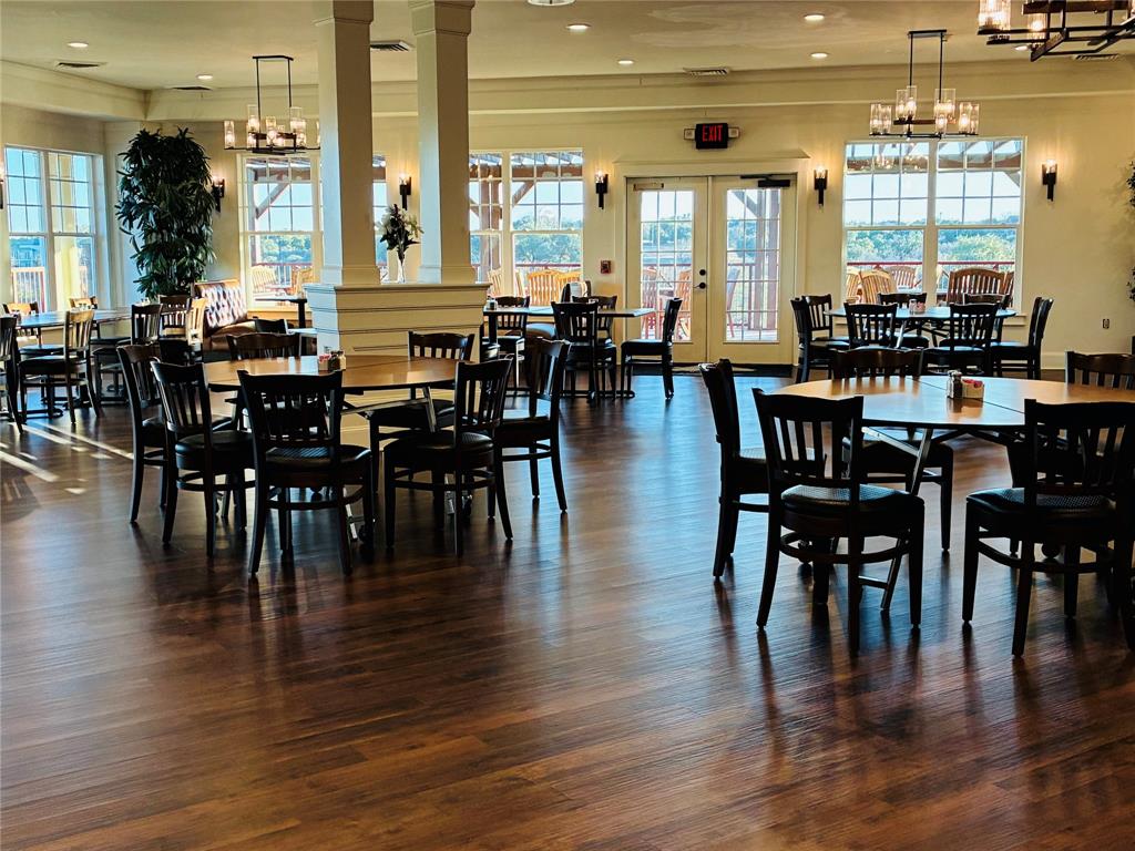 6500 Castle Royle Drive Cleburne, TX 76033 - Photo 14 of 29 a view of dining table and chairs with wooden floor