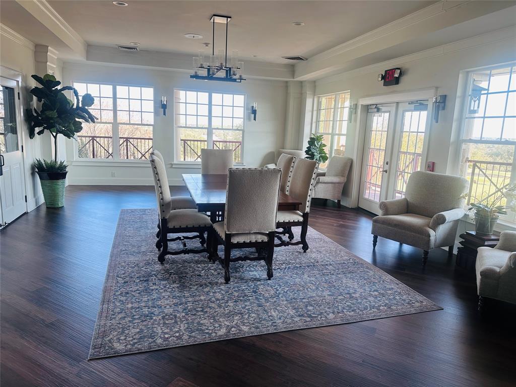 6500 Castle Royle Drive Cleburne, TX 76033 - Photo 16 of 29 a view of a dining room with furniture window and wooden floor