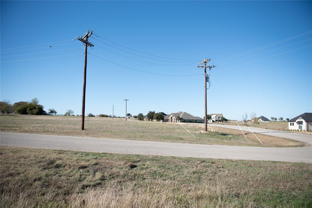 6500 Castle Royle Drive Cleburne, TX 76033 - Photo 6 of 29 a view of a road with a bridge