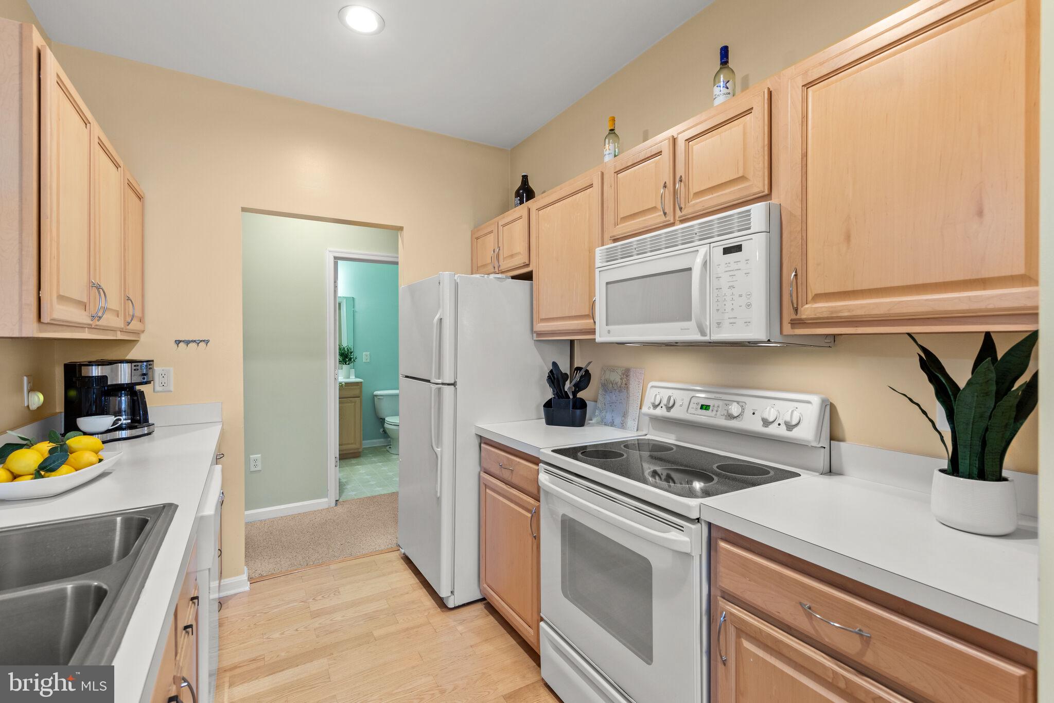 100 Cascade Lane, Unit 108 Rehoboth Beach, DE 19971 - Photo 9 of 36 Galley Kitchen