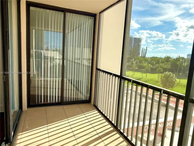 a view of a balcony with wooden floor