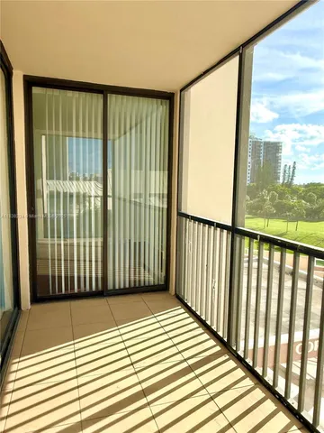 a view of a balcony with wooden floor
