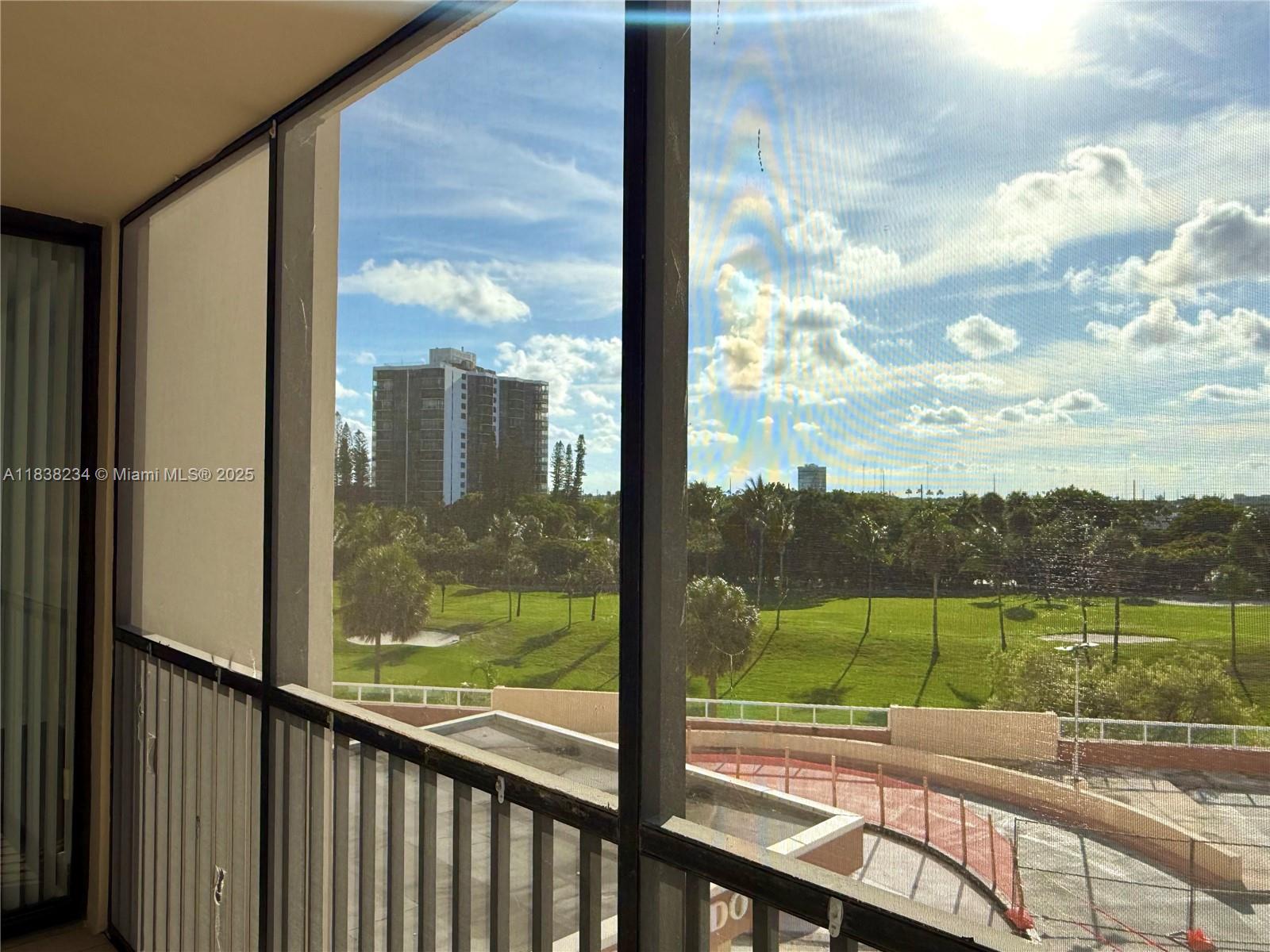 20335 West Country Club Drive, Unit 502 Aventura, FL 33180 - Photo 15 of 26 a view of a city from a balcony