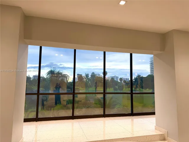 a view of a glass door and an entryway