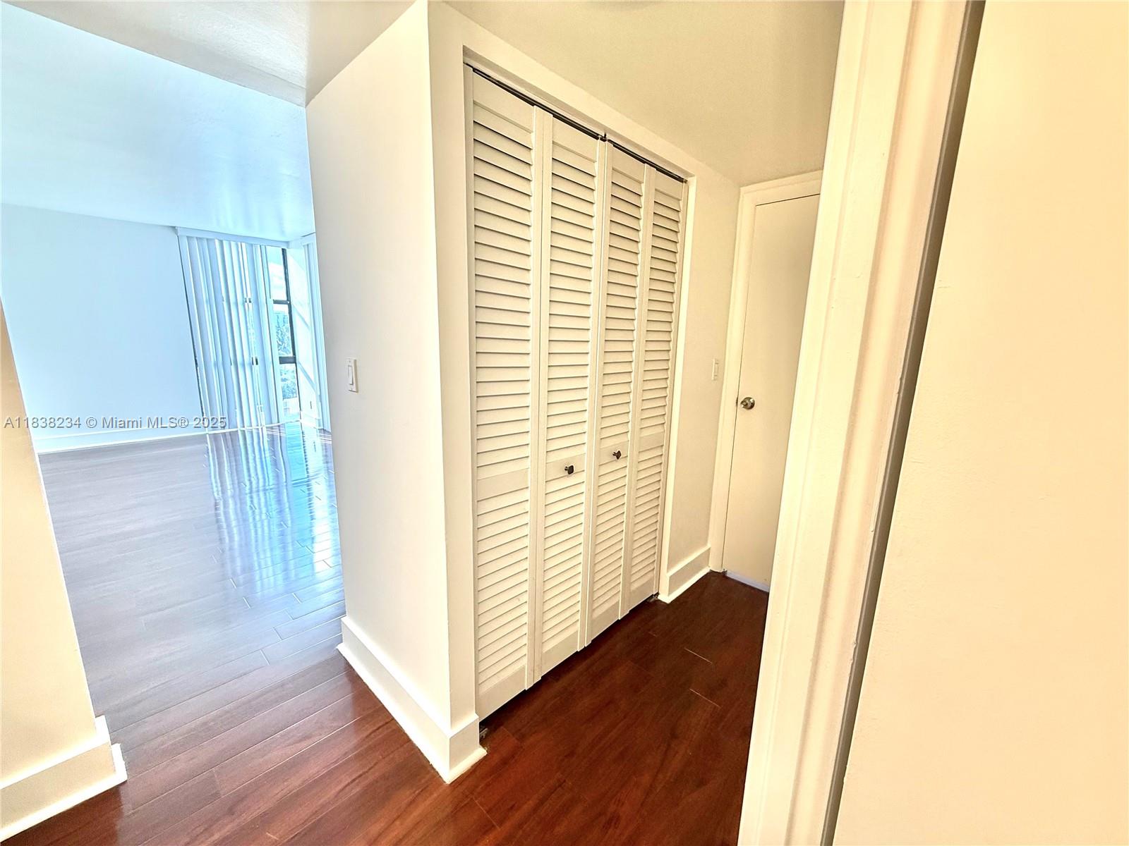 20335 West Country Club Drive, Unit 502 Aventura, FL 33180 - Photo 26 of 26 a view of a hallway with wooden floor