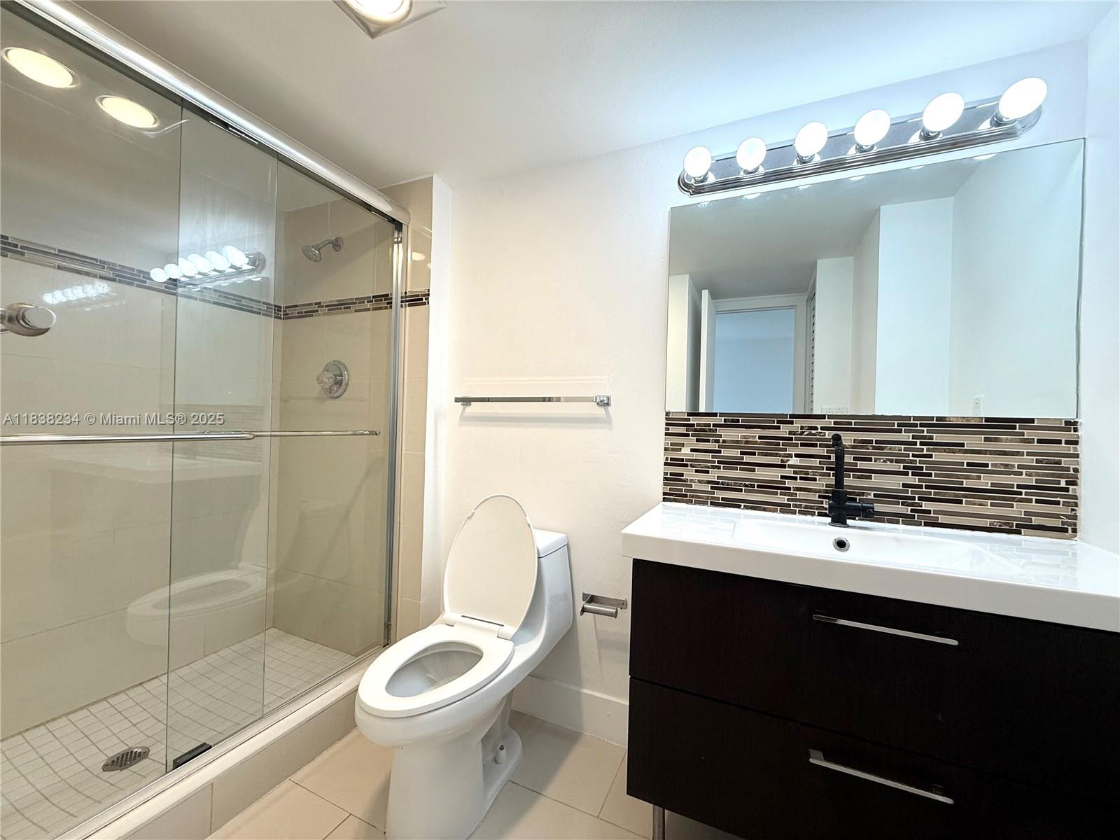 20335 West Country Club Drive, Unit 502 Aventura, FL 33180 - Photo 8 of 26 a bathroom with a sink toilet and shower