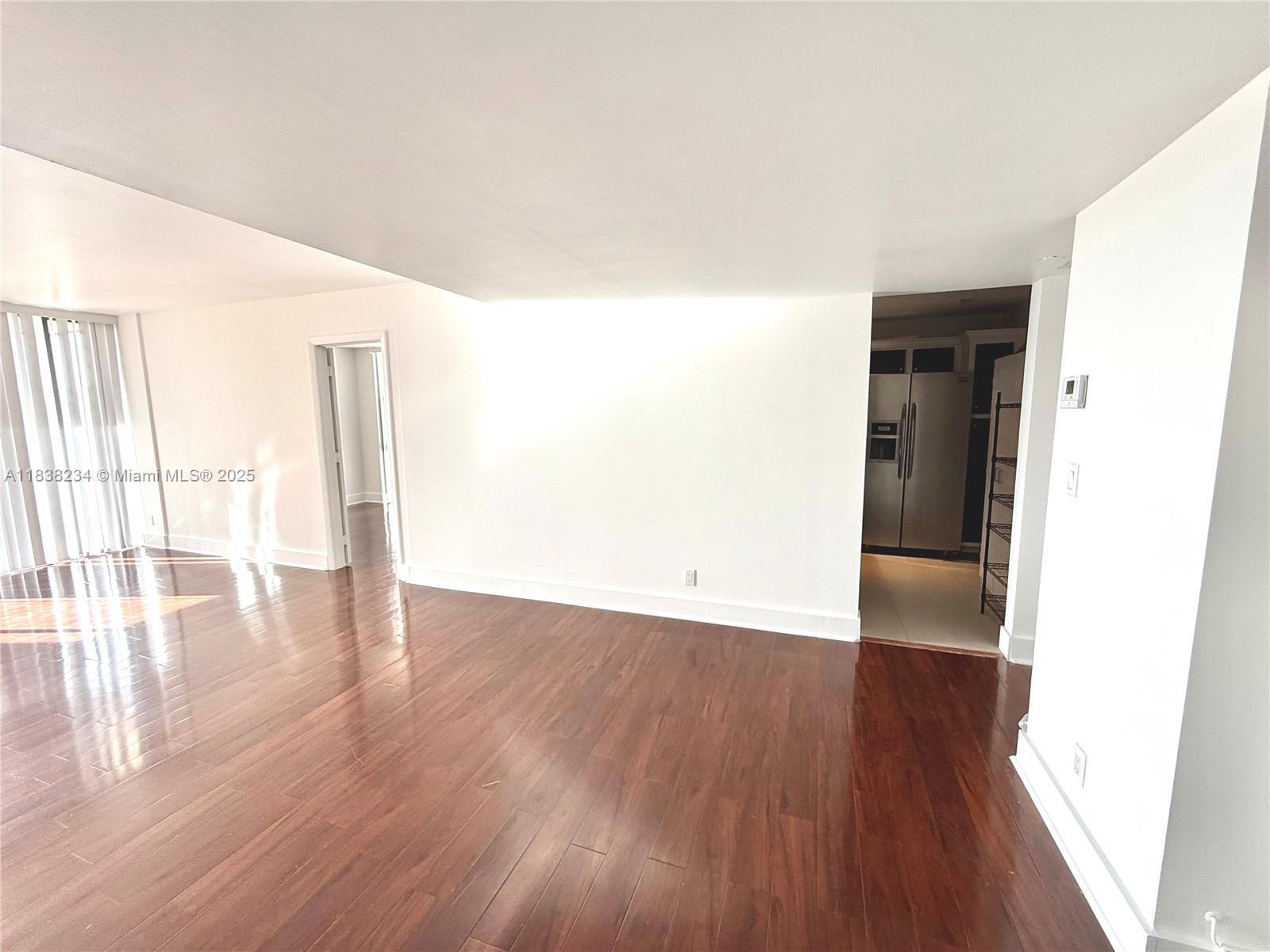 20335 West Country Club Drive, Unit 502 Aventura, FL 33180 - Photo 10 of 26 a view of empty room with wooden floor