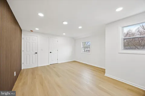 a bathroom with a sink a toilet a shower and a mirror