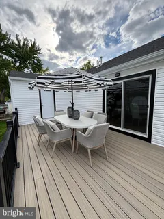 a view of a table and chairs on roof deck