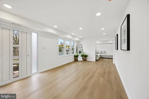 a view of a livingroom with furniture wooden floor and window