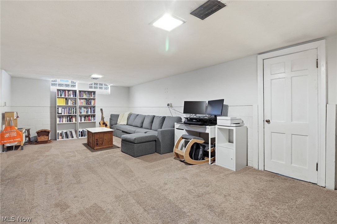 3713 Winchell Road Shaker Heights, OH 44122 - Photo 26 of 38 Spacious lower-level room featuring plush carpeting, recessed lighting, and a neutral color palette
