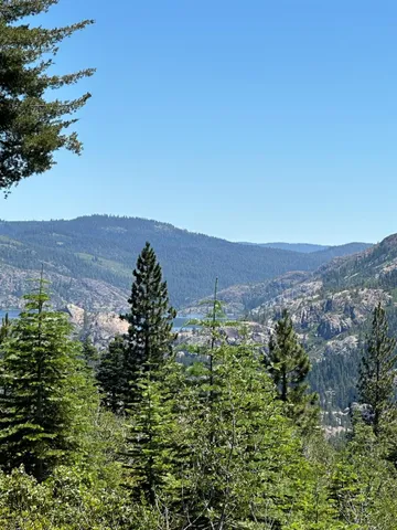a view of a yard with mountain