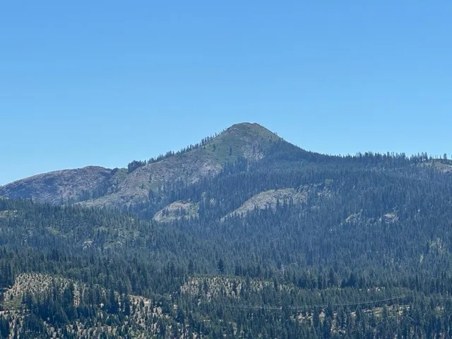 a view of mountains and valleys in the background