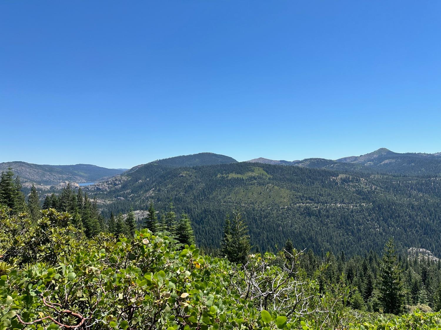 25609 Hoosier Road Nevada City, CA 95959 - Photo 9 of 44 a view of a town with mountains in the background