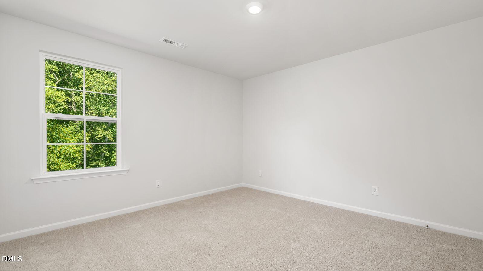 125 Daniel Road Smithfield, NC 27577 - Photo 19 of 22 an empty room with a window