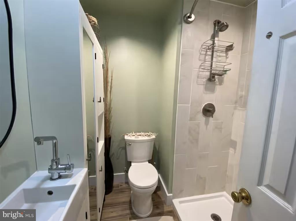 13803 Fountain Road Ocean City, MD 21842 - Photo 13 of 23 a bathroom with a sink toilet and shower
