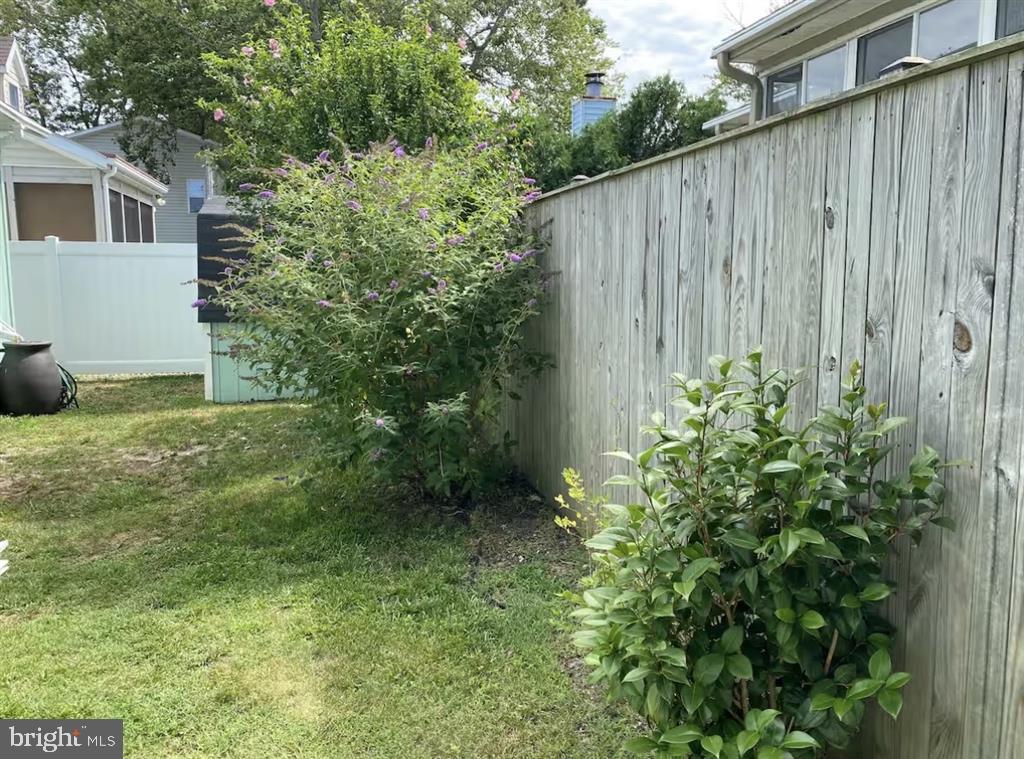 13803 Fountain Road Ocean City, MD 21842 - Photo 21 of 23 a view of a backyard with plants and large trees