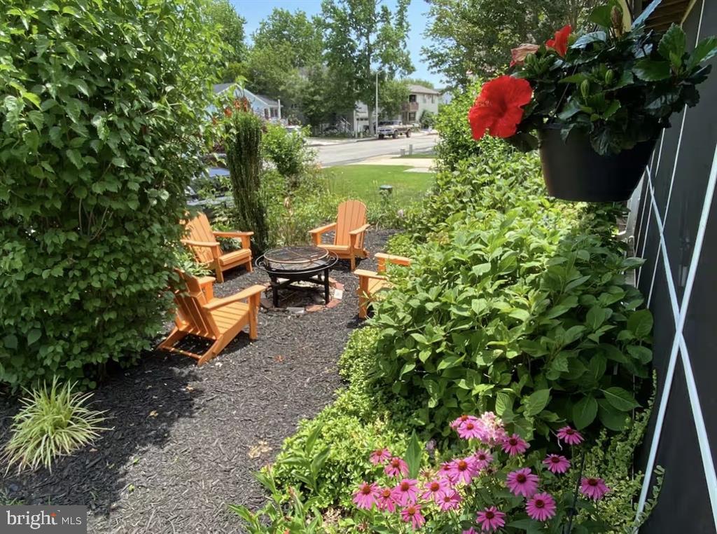 13803 Fountain Road Ocean City, MD 21842 - Photo 23 of 23 a view of a garden with a bench