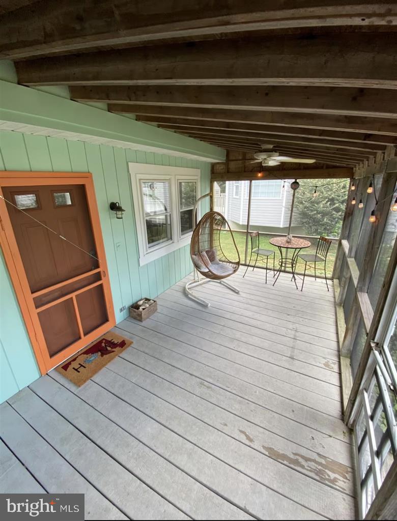 13803 Fountain Road Ocean City, MD 21842 - Photo 4 of 23 a view of a two chair in the balcony