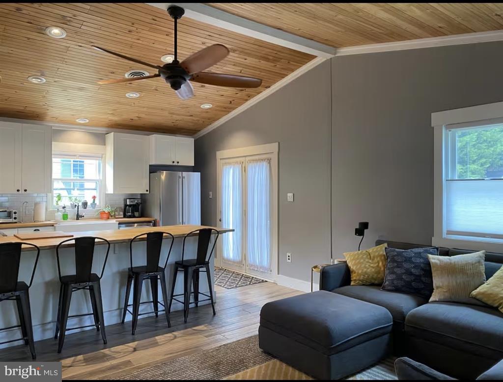 13803 Fountain Road Ocean City, MD 21842 - Photo 10 of 23 a living room with furniture a dining table and a window