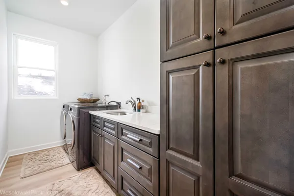 a kitchen with a refrigerator and a sink