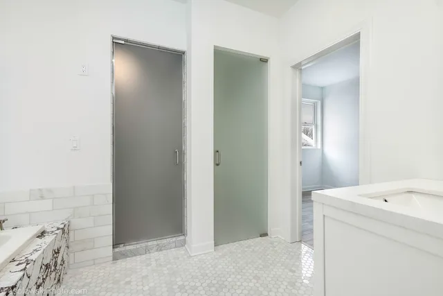 a bathroom with a sink and mirror