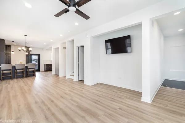 a view of livingroom with hardwood floor and ceiling fan