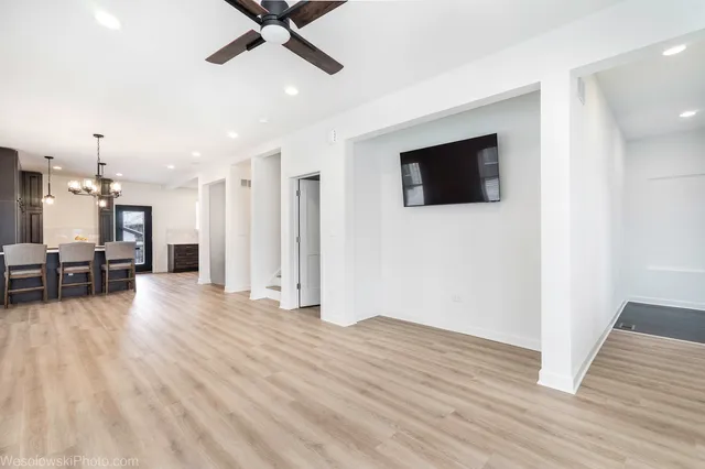 a view of livingroom with hardwood floor and ceiling fan