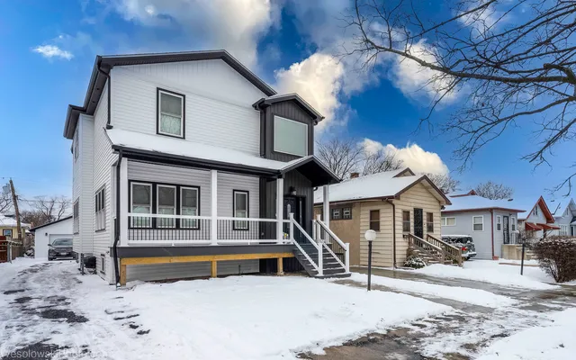a view of a house with a roof deck