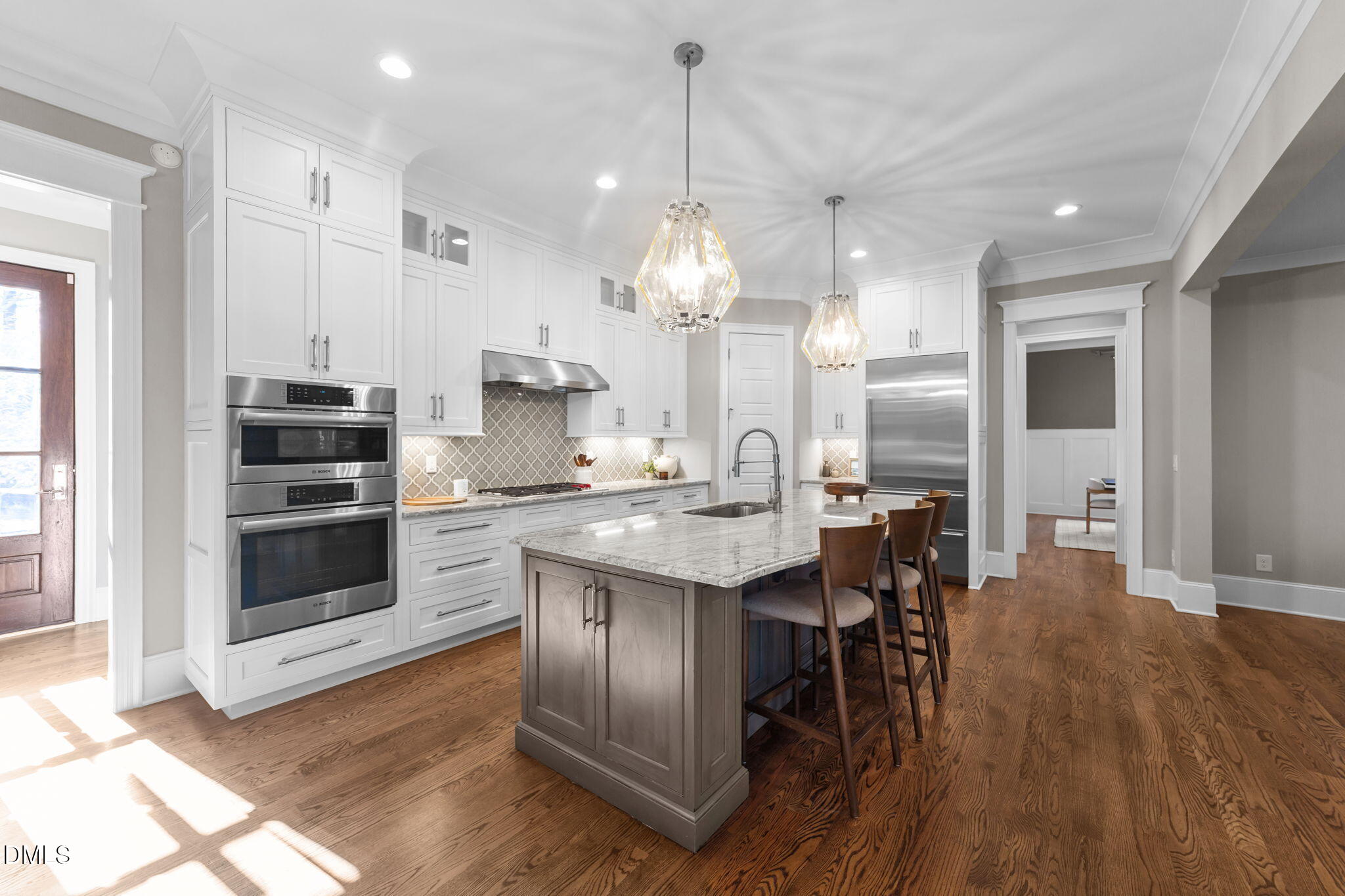 2600 Oxford Road Raleigh, NC 27608 - Photo 11 of 42 a kitchen with stainless steel appliances a dining table chairs stove and sink
