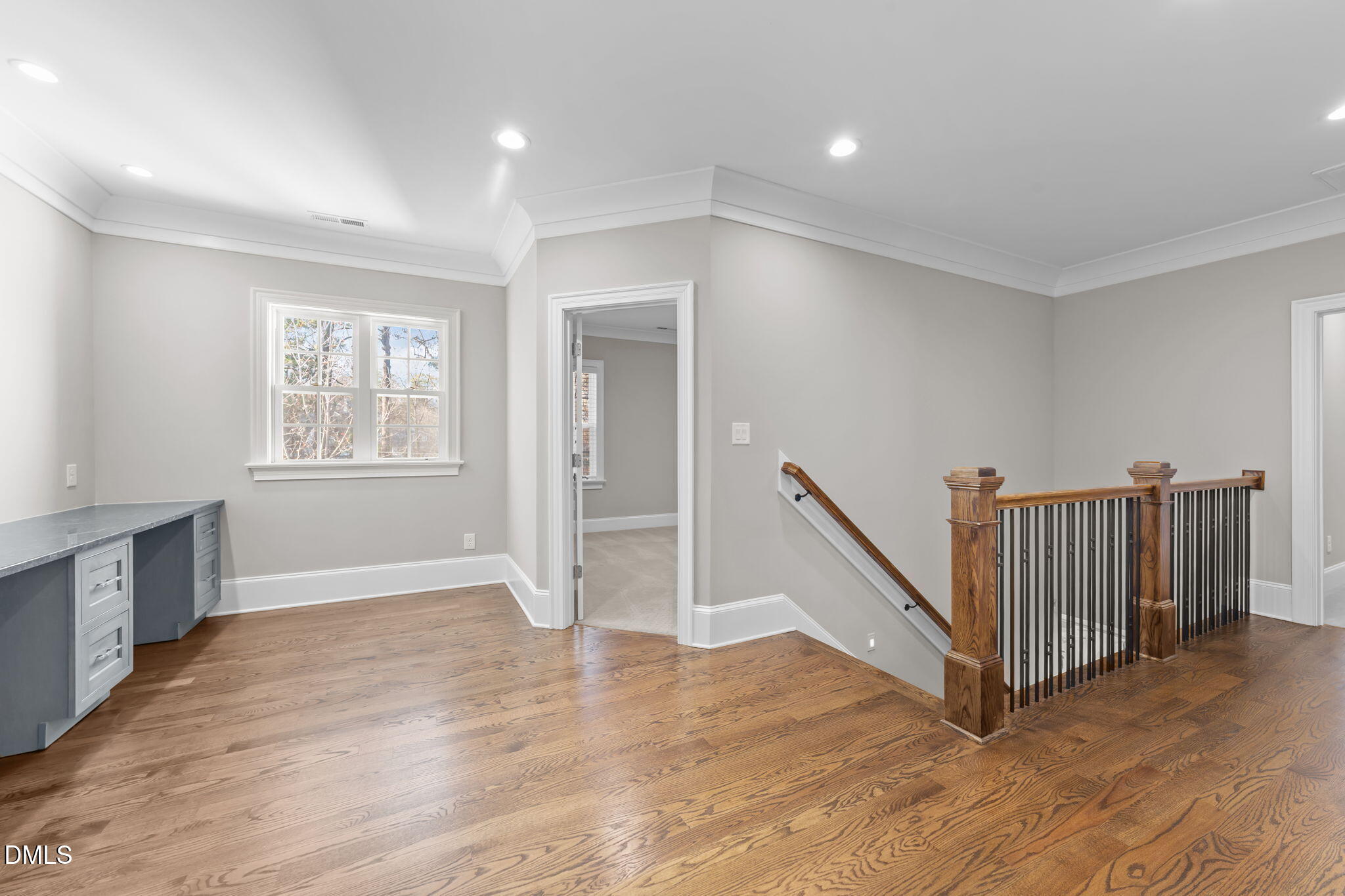 2600 Oxford Road Raleigh, NC 27608 - Photo 30 of 42 a view of an empty room with wooden floor and a window