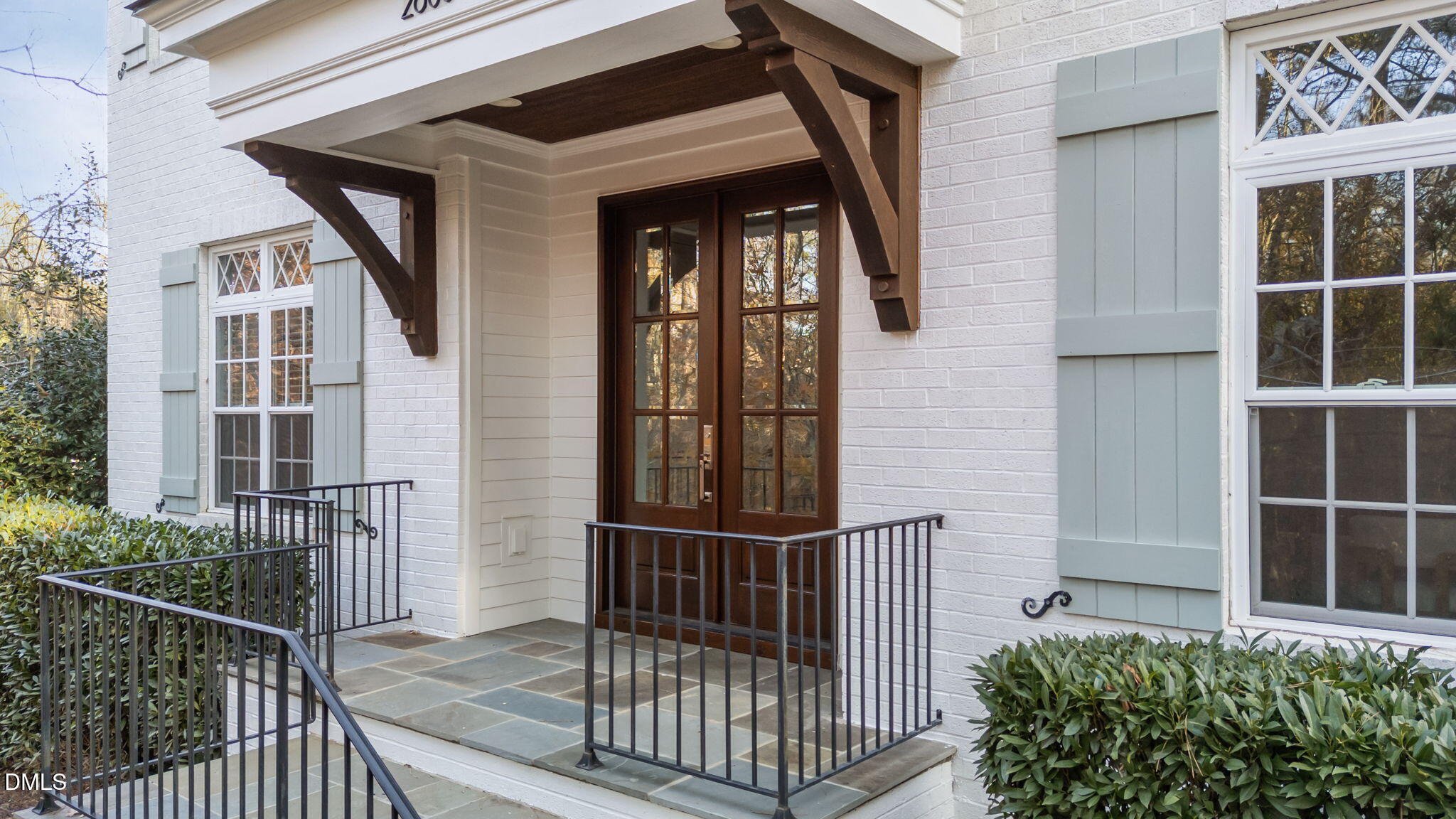 2600 Oxford Road Raleigh, NC 27608 - Photo 4 of 42 a view of a balcony with a potted plant and wooden floor