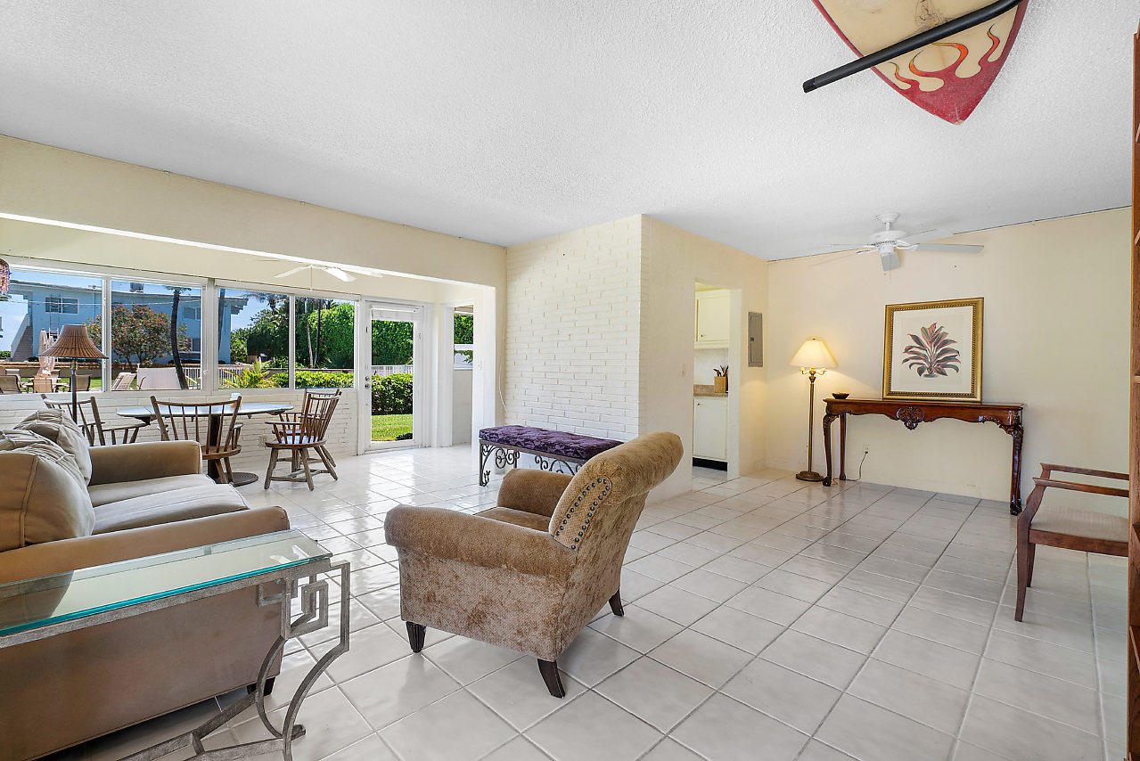 5700 Old Ocean Boulevard, Unit V Ocean Ridge, FL 33435 - Photo 11 of 24 a living room with furniture and a table