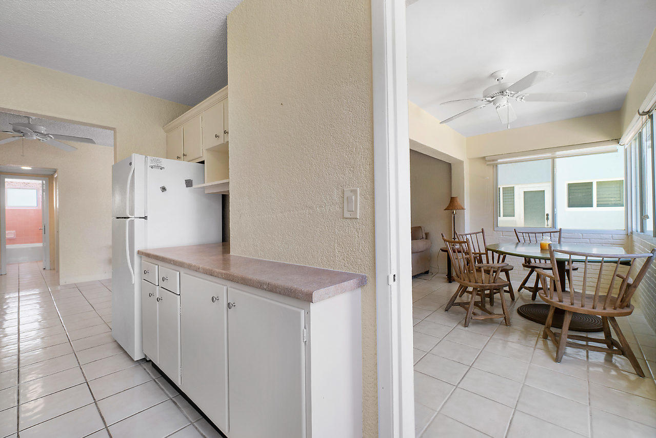 5700 Old Ocean Boulevard, Unit V Ocean Ridge, FL 33435 - Photo 13 of 24 a spacious bathroom with a granite countertop sink a mirror and a shower