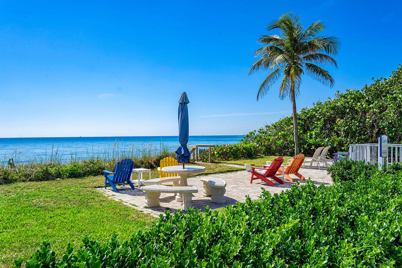 5700 Old Ocean Boulevard, Unit V Ocean Ridge, FL 33435 - Photo 5 of 24 a view of a garden with an outdoor seating