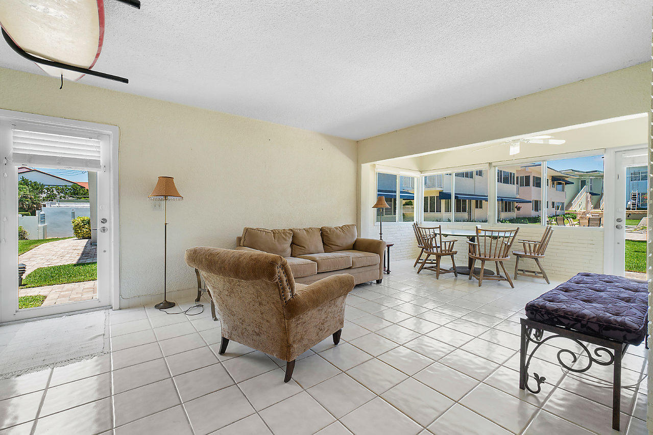 5700 Old Ocean Boulevard, Unit V Ocean Ridge, FL 33435 - Photo 9 of 24 a living room with furniture and a table