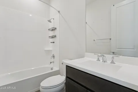 a view of living room kitchen and entryway