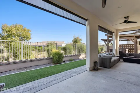 a large white kitchen with stainless steel appliances granite countertop a stove and a large window