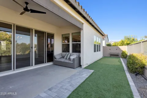 a spacious bathroom with a granite countertop sink a mirror and shower