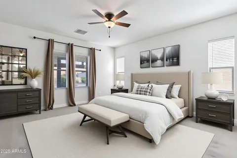a bedroom with a large bed and wooden floor