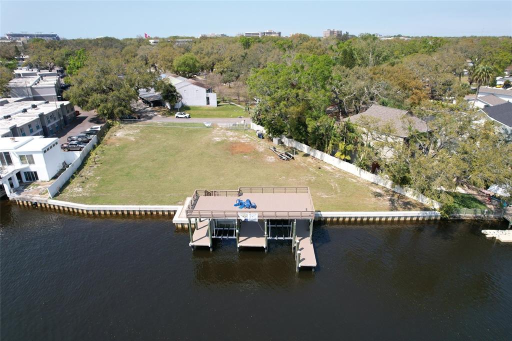 4033 North River View Avenue Tampa, FL 33607 - Photo 2 of 66 an aerial view of a house with a table chairs and a fire pit