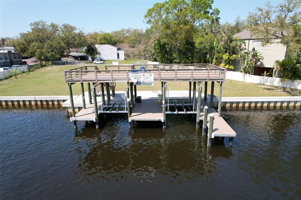 4033 North River View Avenue Tampa, FL 33607 - Photo 23 of 66 a view of a lake with a house swimming pool and outdoor space